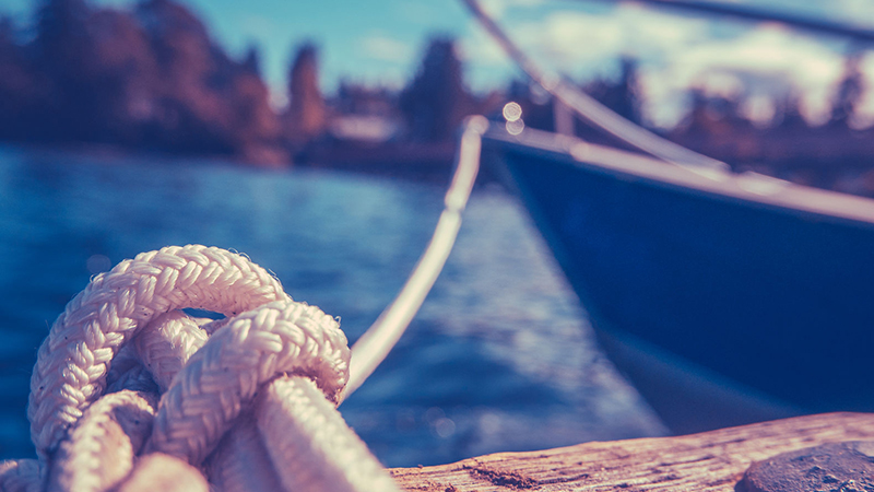 44264404 - retro filtered photo of a luxury yacht tied to pier